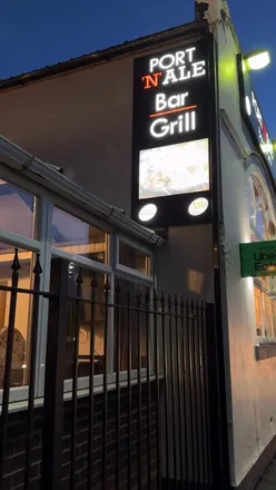 Delicious feast at Port ‘N’ Ale in Tipton featuring mixed grill, goat curry, and unique dishes in a cozy atmosphere.