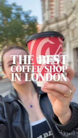 Enjoying gluten-free coffee with oat milk at Change Please, a social enterprise in London fighting homelessness.