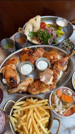 Whole rotisserie chicken at @toumrotisserie in Mayfair, blending Lebanese & French flavors, praised for its quality.