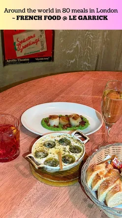 Enjoying French cuisine at Le Garrick, a romantic bistro in Covent Garden, London, featured in 'Around the World in 80 Meals'.