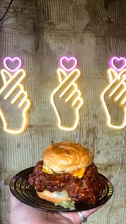 Delicious K-Food spread featuring fried chicken and snacks from Zaxx in London, showcasing foodie passion and culture.