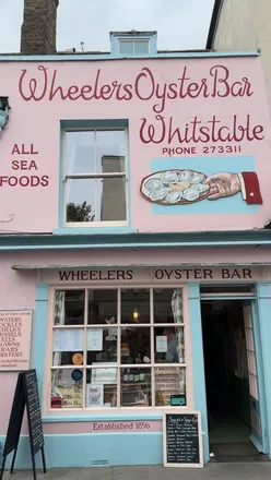 Seaside stroll from Whitstable to Herne Bay, featuring colorful beach huts and beautiful ocean views.