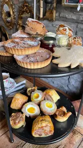 Seasonal autumn afternoon tea featuring finger sandwiches, savouries, and desserts at Food By Sean No600 in Swansea.