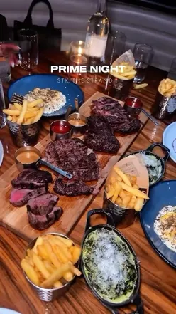 Guests enjoying PRIME NIGHT at STK London with cocktails and lively entertainment every Friday night.