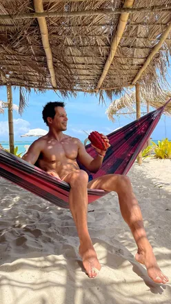 Excited travelers discussing a Jet2Holiday for a Brazilian group trip, surrounded by travel vibes and adventure.