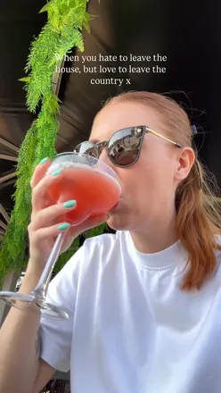 User planning a trip with Skyscanner, featuring travel hashtags and excitement for exploring new destinations.