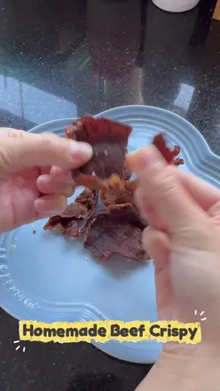 Healthy homemade crispy beef dish served with @celeplate, showcasing golden-brown beef slices fresh from the air fryer.