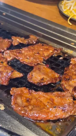 Authentic Chinese BBQ in Manchester serving halal meats with a hands-on dining experience across three lively floors.