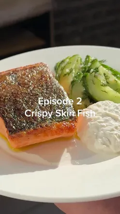 Crispy skin salmon with cucumbers and horseradish yogurt, featured in a fish cookery episode.