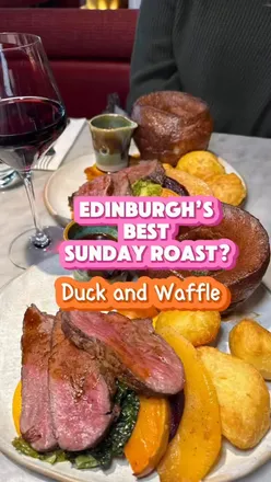 Indulging in a delicious two-course Sunday roast with beef, roast potatoes, and desserts at Duck and Waffle, Edinburgh.