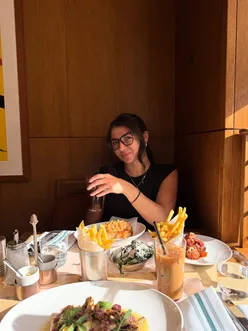 Chic interior at The Park London, featuring plush booths and golden-hour glow for a trendy dining experience.