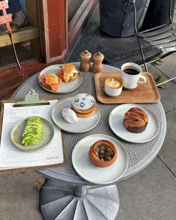 Autumn coffee morning at Boxcar London in Connought Village, featuring pastries and brunch dishes.