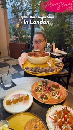Cozy date night at Mare Street Market in King's Cross, enjoying a Banana Split and Double Smash Patty Cheeseburger.
