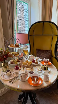 Indulgent afternoon tea inspired by Marie Antoinette at Belmond Cadogan in London, featuring exquisite treats and scents.