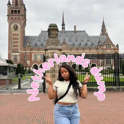 Solo traveler enjoying ribeye steak and mimosa in cozy Amsterdam café, capturing moments of a spontaneous trip.