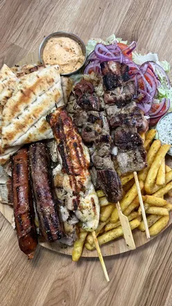 Mixed grill and gyros at the grand opening of Greek & Famous in Cheadle, showcasing authentic Greek cuisine.