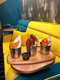 Guests enjoying cocktails and gourmet small plates at The Avenue Omniplex in Sunderland's luxury cinema lounge.