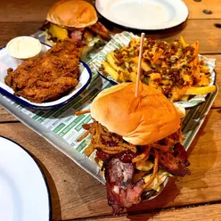 Delicious Smoky Bro Burger and dirty hot fries at Three Brothers Burgers, a unique Bristol eatery on a boat.