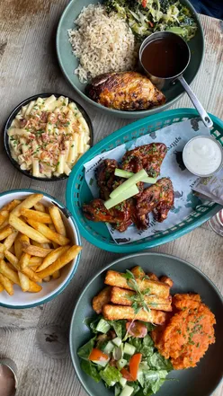 Build-your-own lunch bowls with chicken and sides at Spitroast, Liverpool, featuring homemade lemonade.