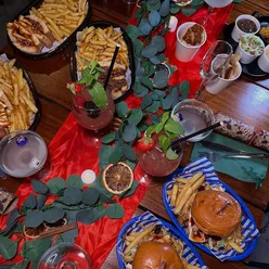 Celebrating Christmas parties at Kargo MKT, featuring festive drinks and delicious food from various vendors in Manchester.