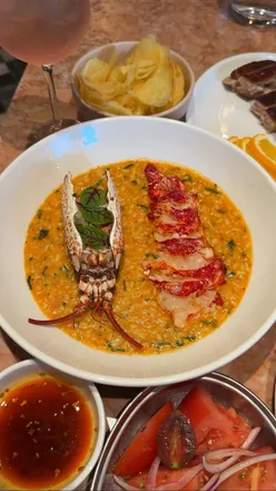 Delicious lobster rice and langoustines at Luso Restaurant, London's new Portuguese-inspired dining spot.