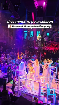 Guests enjoying an immersive ABBA-themed dining experience at Mamma Mia! The Party in London’s O2 arena.