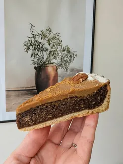 Pecan pie topped with Biscoff at Little Perth, showcasing delicious textures and balanced flavors in Westbourne.