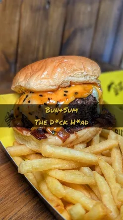 Thick patty burger 'The d*ck H*ad' from Bun and Sum at their Bow store, a must-try for London burger lovers!