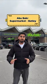 Customers exploring a vast selection of halal products at Abu Bakr Supermarket in Batley, UK.