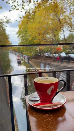 Guests enjoying a cozy October meal at La Villa Restaurant in Little Venice, London surrounded by autumn leaves.