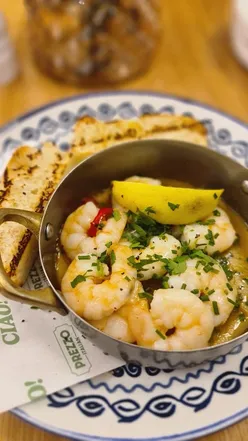 Couple enjoying a stylish meal at Prezzo Italian in Nottingham, featuring delicious dishes and a vibrant atmosphere.
