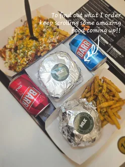 Delicious Angus beef burger and Nashville chicken with loaded fries at MLK Burgers in Cheadle.