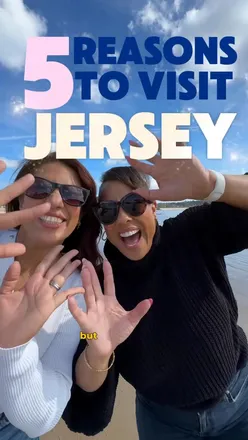 Excited travelers sharing a fun trip in Jersey, exploring beautiful beaches and attractions, with DFDS ferry promotion.