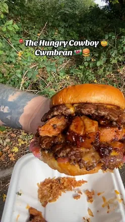 Delicious Texas BBQ burger and loaded fries from The Hungry Cowboy in Cwmbran, showcasing high-quality flavors.
