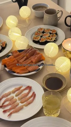 Colorful homemade sushi spread with maki, salmon, and chawanmushi, inspired by a cozy Japanese night at home.