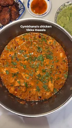 Delicious homemade chicken tikka masala and chutney for Diwali celebration, perfect for a cozy autumn meal.