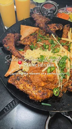 Delicious tawa featuring lamb chops, seekh kebabs, and mango lassi at Saleem's Tawa and Grill in Manchester.