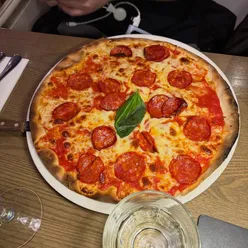 Dinner at Toni Italian Restaurant in Dublin: carbonara, gluten-free pizza, and cheesy garlic bread before a pub crawl.