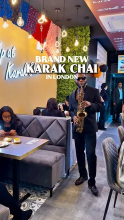 Enjoying delicious Butter Chicken Naan Melt and Karak Chai at the vibrant Karak Chaii in Hillingdon.