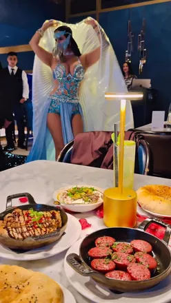 Luxury rooftop dining at Sky Bar, Hyatt Regency Albert Embankment, featuring stunning views and Lebanese cuisine.