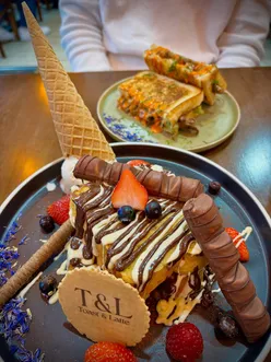 Delicious kinder bueno French toast and Philly steak sandwich at Toast & Latte in Birmingham, perfect for brunch lovers.