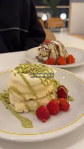 Soufflé pancakes with Nutella, strawberry, pistachio, and raspberry at Fluffy Fluffy UK, Nottingham.