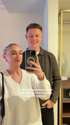 Couple enjoying a romantic getaway with a massage and dinner at Roe Valley Resort, excited for upcoming spa phase.