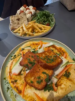 Delicious halloumi flatbread and Caprese sandwich at Café Filto, a trendy Newcastle eatery with fresh ingredients.