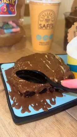 Visitors enjoying indulgent desserts like milkshakes and brownies at Safi's Desserts in Liverpool's Mount Pleasant.