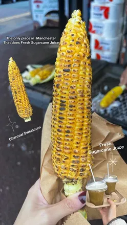Fresh sugarcane juice and grilled charcoal sweetcorn at Rizwan Grocery Store, Cheetham Hill, Manchester.