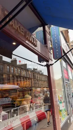 Guests enjoying authentic Italian dishes at Little Italy in Glasgow's West End, showcasing vibrant dining atmosphere.