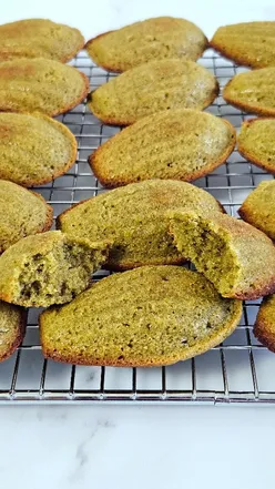 Three-ingredient pistachio madeleines baking process with flour, pistachio cream, and eggs in a bowl.