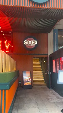 Enjoying fun games and delicious food at Sixes Social Cricket in Bristol—perfect for friends or date nights!