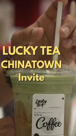 Visitors enjoying bubble teas and shaved ice desserts at Lucky Tea in Chinatown London, featuring vibrant dining atmosphere.